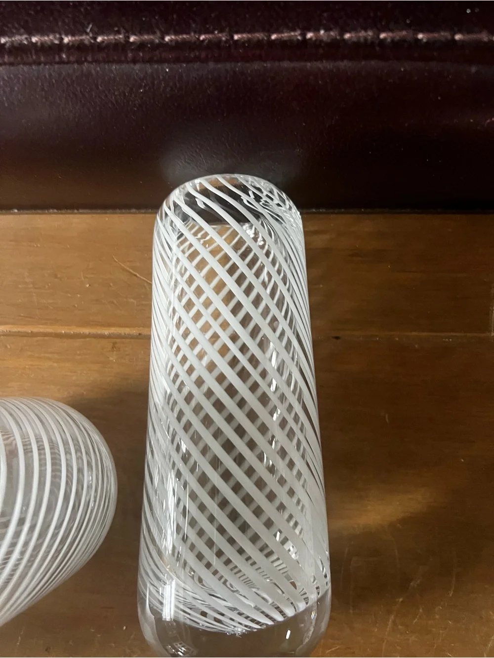 Set of three hand blown vases. Beautiful with white swirls.